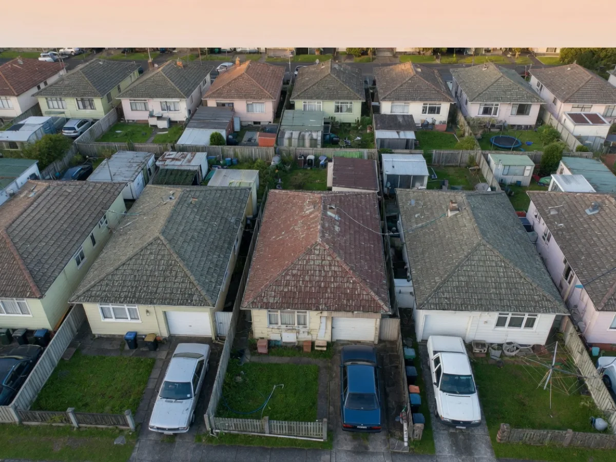 Closely spaced Auckland suburban roofs where neighbour protection matters, Tomar Contracting Auckland