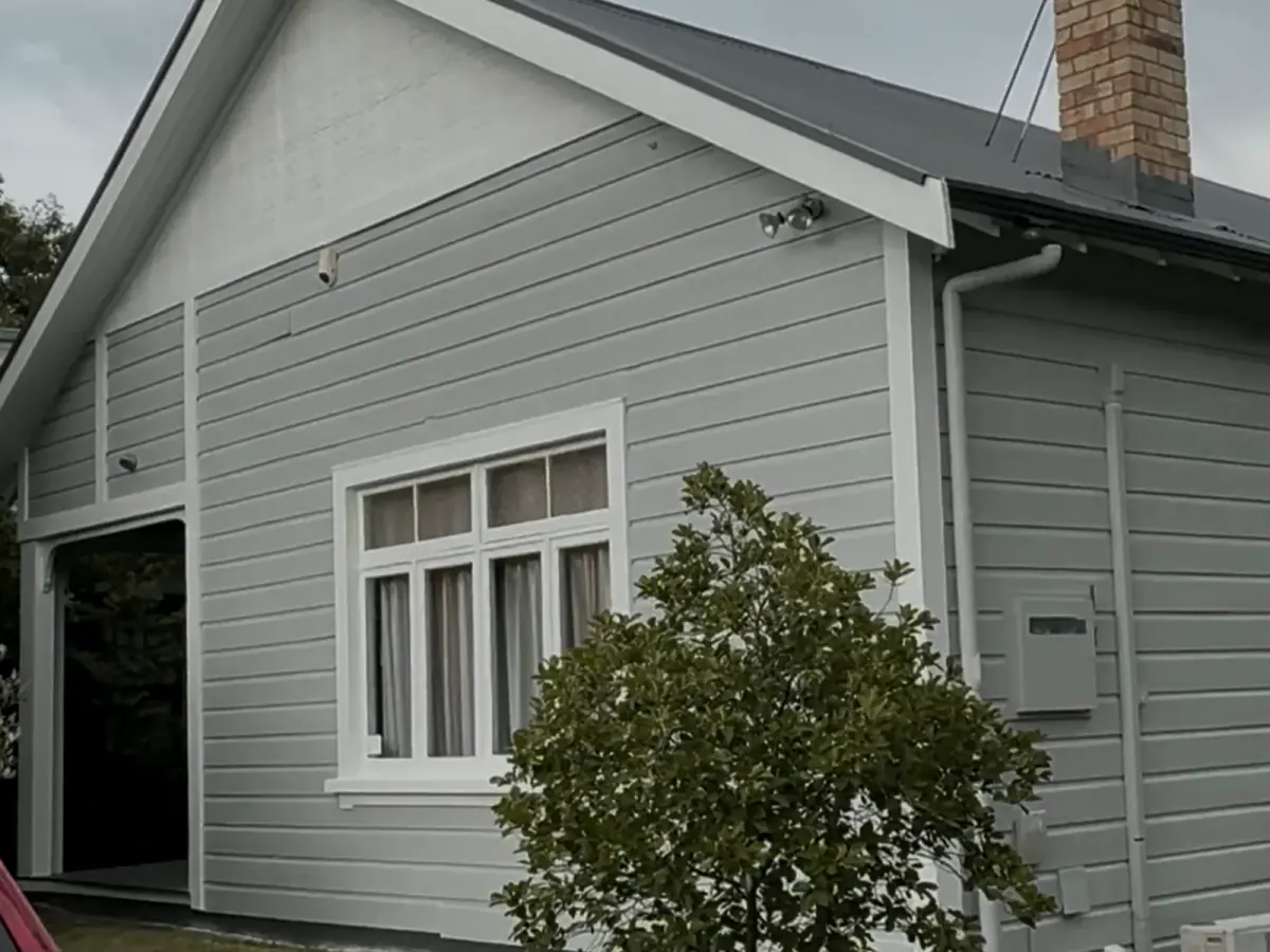Freshly painted grey weatherboard Auckland house exterior with white joinery, Tomar Contracting Auckland